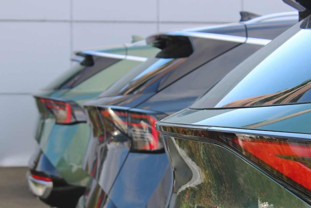 Row of business vehicles parked in a fleet, representing asset growth and the need to review insurance coverage as SMEs expand operations.
