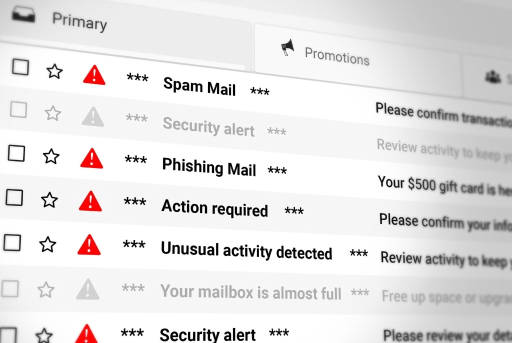 Employee viewing suspicious phishing email illustrating social engineering attack targeting Australian businesses.
