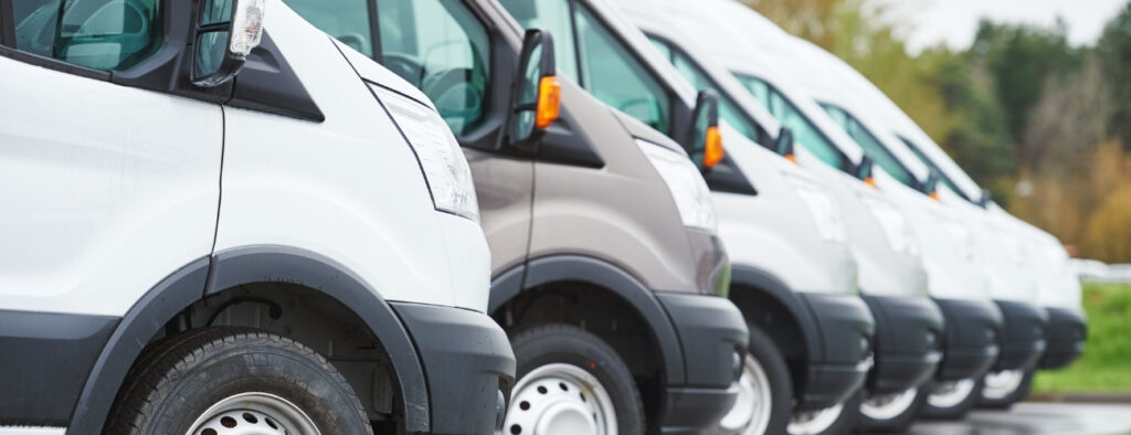 Commercial fleet vehicles lined up for a business fleet motor insurance review